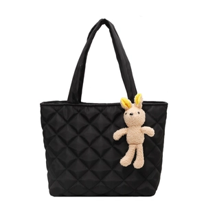 Quilted nylon tote bag for women with black diamond lattice design and rabbit charm