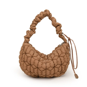 Caramel brown quilted nylon dumpling bag with pleated handle and crescent moon shape