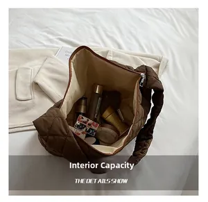 Overhead view showing the large internal capacity of this brown quilted hobo bag