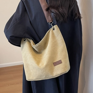 Minimalist canvas tote bag with brown leather strap and FASHION patch for women