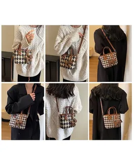 Fashionable mini bucket bag with houndstooth pattern and leather strap in various poses