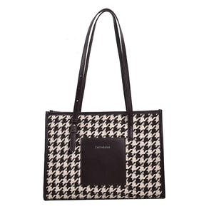 Houndstooth pattern tote bag with leather logo patch and adjustable brown shoulder straps
