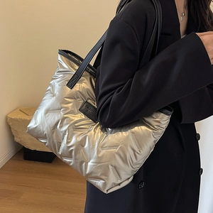 Metallic silver oversized tote bag with V-quilted pattern for casual daily commuting
