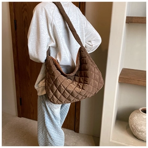 Detail of coffee brown quilted hobo bag with large capacity and soft oxford fabric
