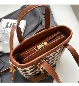 Top view of bucket bag interior showing smooth metal zipper and brown leather lining