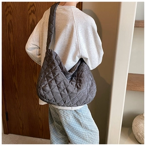Deep grey quilted oxford cloth tote bag showing large capacity in a lifestyle back view