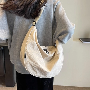 Fashionable beige nylon half-moon crossbody bag with adjustable strap for women