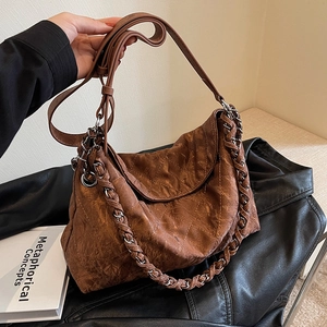 Vintage brown quilted hobo bag with adjustable leather strap and chain handle