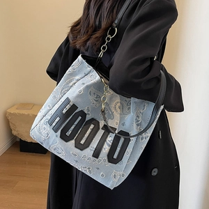 Light blue paisley denim tote bag with HOOTO letter patch and black chain strap