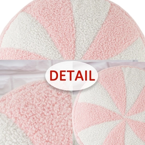Cojín redondo de felpa rosa y blanco en forma de caramelo con tejido suave