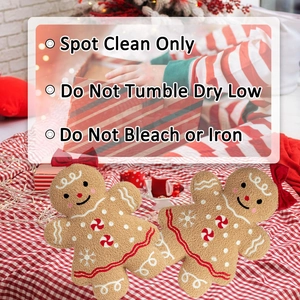 Gingerbread man plush pillows with festive red bow and candy buttons in holiday setting