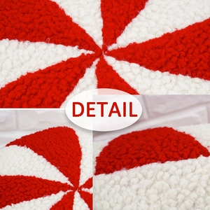 Red and white swirl pattern round peppermint plush cushion in soft sherpa fabric