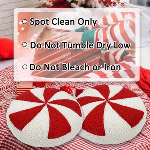 Set of two round red and white peppermint candy striped pillows for Christmas home decor