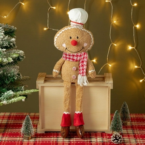 Christmas gingerbread man chef doll with long dangling legs and festive decorations