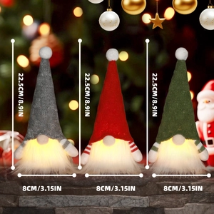 Three LED Christmas gnomes with pointed hats and glowing beards in red, green and grey