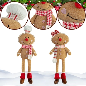 Close-up of plush gingerbread man chef couple with embroidery details and festive scarfs