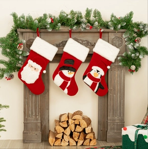 Three-piece set of red velvet Christmas stockings featuring Santa, Snowman and Penguin