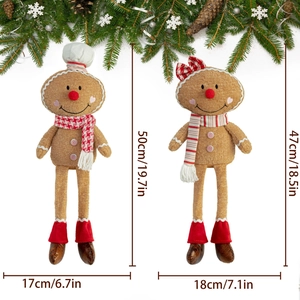 Close-up of plush gingerbread man couple dolls with long legs and Christmas chef hats
