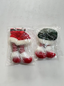 Macro view of Christmas tree leg ornaments in red and green festive fabric packaging