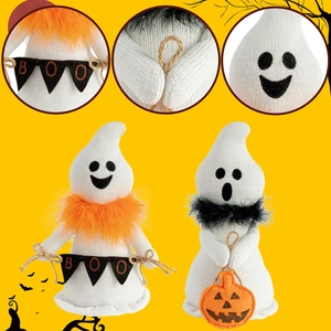 Halloween knitted ghost figurines with BOO banner and pumpkin lantern on yellow background