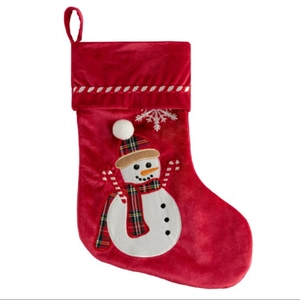 Red velvet Christmas stocking with plush snowman embroidery and hanging loop decoration