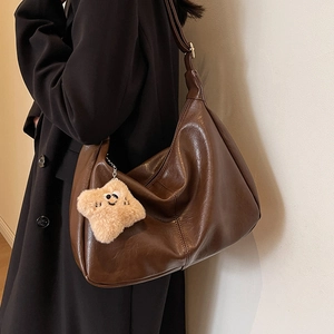 Deep brown large capacity hobo bag with cute plush star charm and adjustable strap