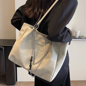 Minimalist beige tote bag with silver chain and MOONSHARK logo for women's autumn style