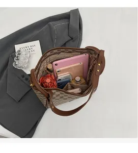 Top view of spacious interior with organizer pockets in vintage monogram tote bag