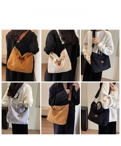 Detail showing various colors of large capacity corduroy tote bags with shoulder straps