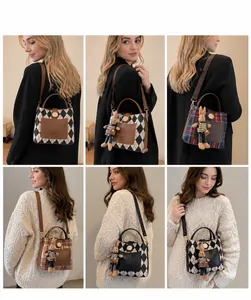 Detail view of stylish crossbody bucket bags with plaid patterns and plush rabbit charms