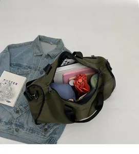 Detailed view of spacious green duffel bag interior with organized daily essentials