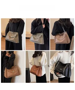 Close-up of leather chain bag with metallic lock and flap detail in multiple colors