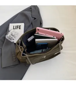 Spacious olive green tote bag interior showing capacity for tablet, phone, and daily essentials