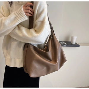 Detail of coffee brown large hobo bag with natural crinkle texture and metal buckle adjustment