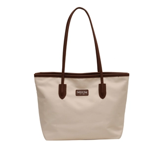 Minimalist large capacity contrast tote bag with brown leather handles and New York logo