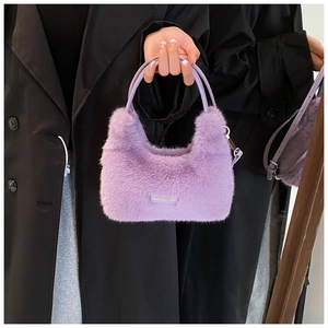 Detail of soft purple faux fur handbag with fluffy texture and stylish crescent shape