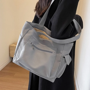 Large capacity grey canvas tote bag with front zipper pocket for casual daily commute