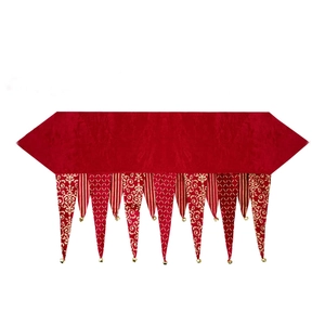 Elegant red Christmas table runner with golden patterns and hanging bell tassels