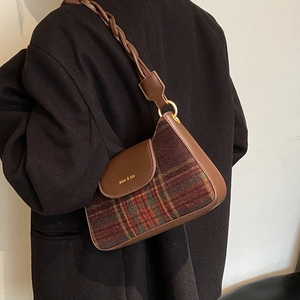 Vintage plaid underarm bag for women with woven strap and gold buckle in a retro style
