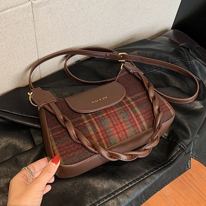 Brown plaid patchwork underarm bag with gold lettering and adjustable shoulder strap