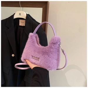 Detailed texture of fluffy purple faux fur handbag with stylish leather handles