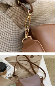 Détails macro des finitions dorées et coutures d'un sac seau en cuir marron