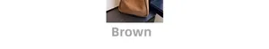 Detail of the brown canvas bucket bag showing fabric texture and a leather logo patch