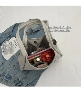 Detailed interior view of a large canvas tote showing spacious capacity with inner pocket