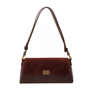 Retro deep brown underarm bag with matte suede texture and gold metallic buckle