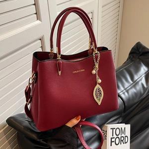 Elegant wine red bridal handbag with gold leaf pearl pendant and stylish handle
