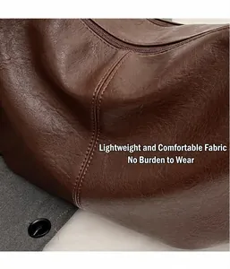 Detailed macro view of brown pebbled leather texture on a large slouchy shoulder bag