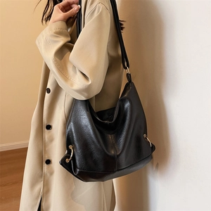 Minimalist black PU leather hobo bag with gold hardware for commuting women