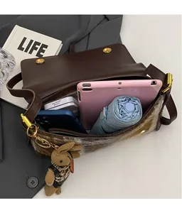 Top view of spacious leopard print crossbody bag showing large internal capacity for iPad