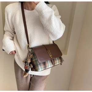 Retro plaid crossbody bag featuring a brown flap and cute bunny doll charm detail